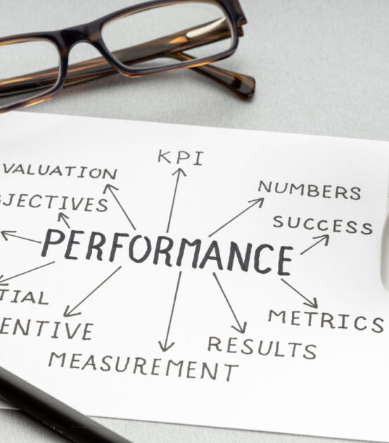 Business Performance strategy concept. Paper sheet with quality ideas or plan, cup of coffee and eyeglasses on desk